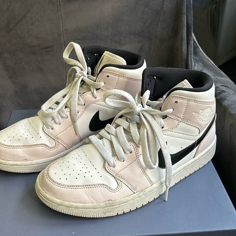 Light pink and white Nike Jordans
